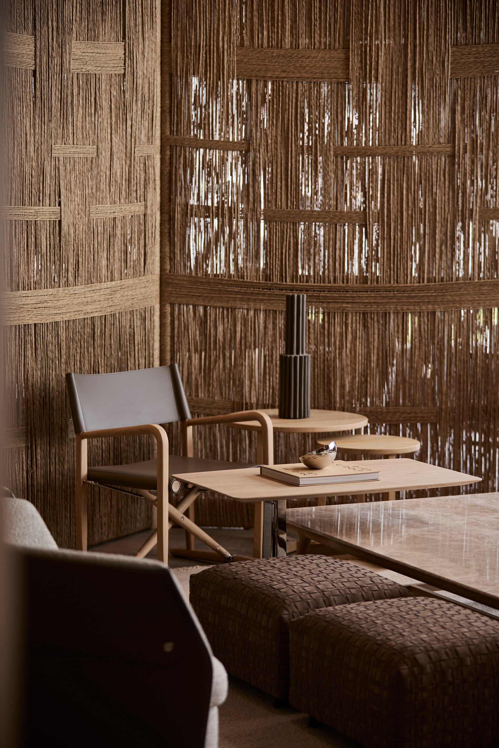 Luchino chair against the woven screens
